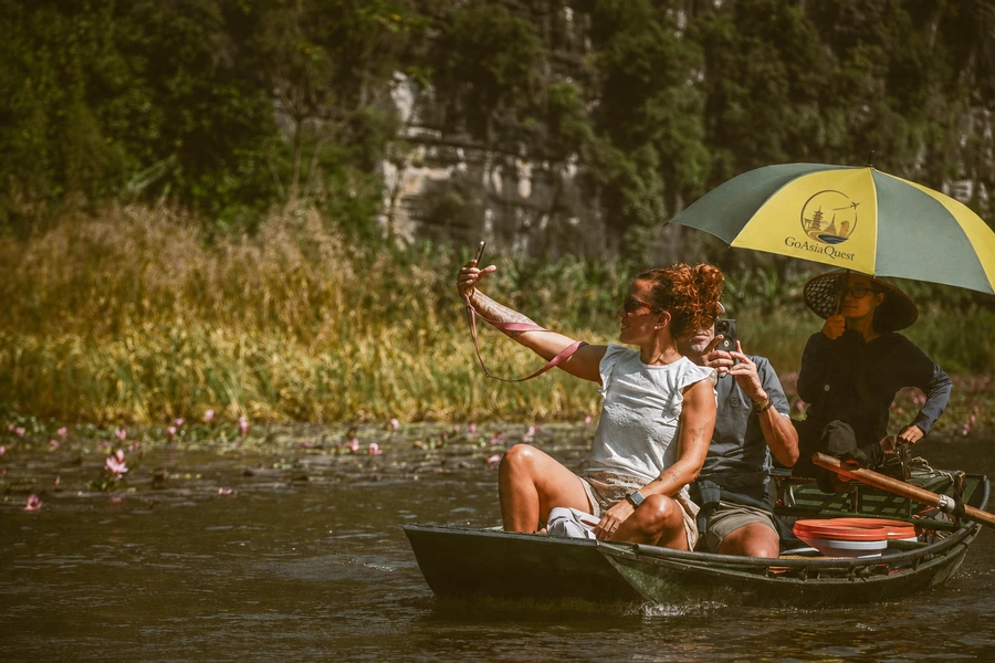 Couple enjoying a private boat journey in Asia with a local guide